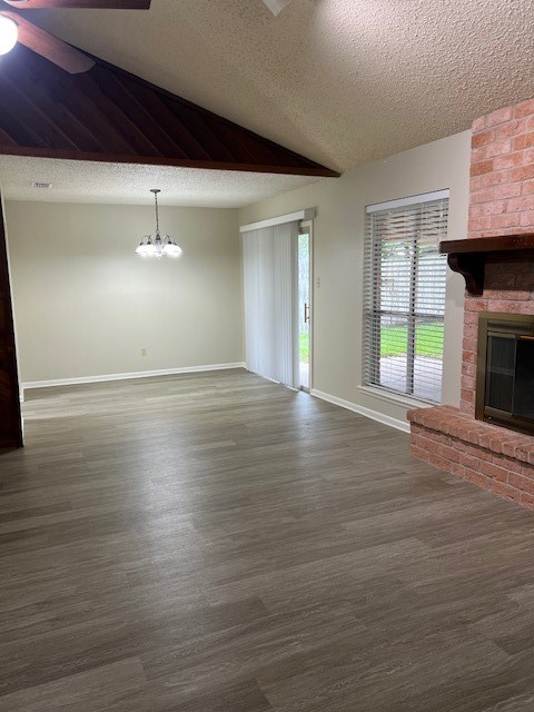 5122 Goldeneye Drive Corpus Christi, TX 78413 - Photo 3 of 14 an empty room with wooden floor fireplace and windows