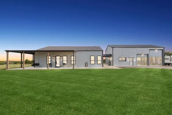 a view of a house with backyard porch and garden