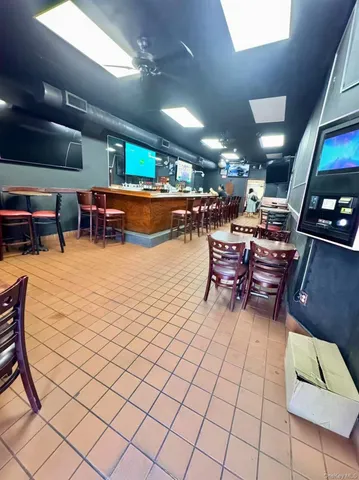a living room with lots of furniture and a flat screen tv