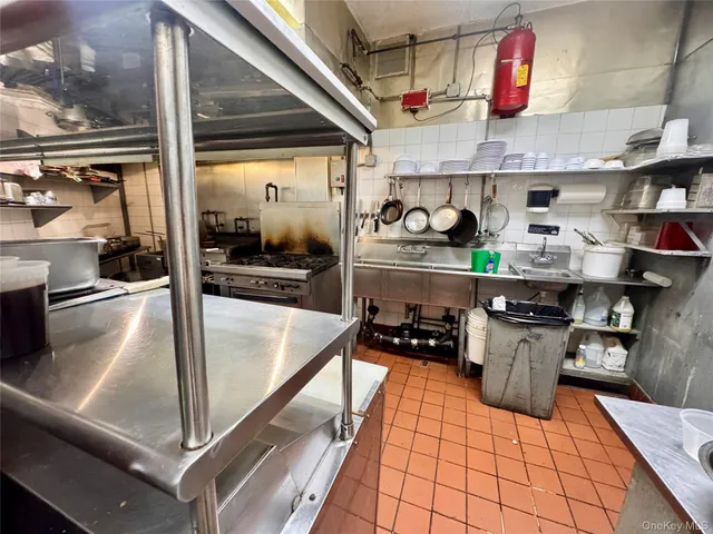 a kitchen with stainless steel appliances granite countertop a sink and counter space