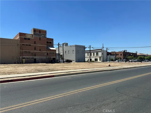 a view of a street with a building