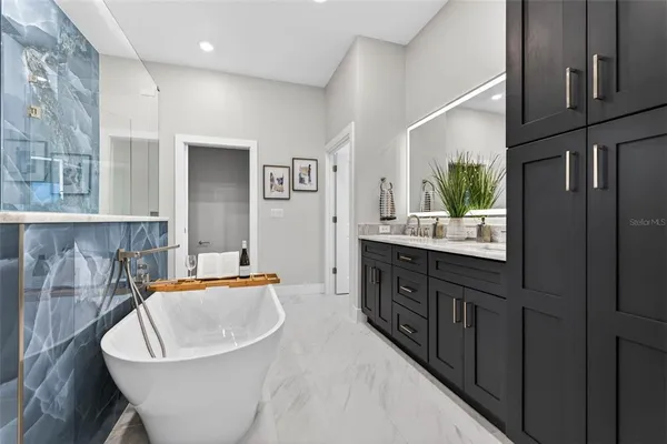 a bathroom with double sink and a mirror