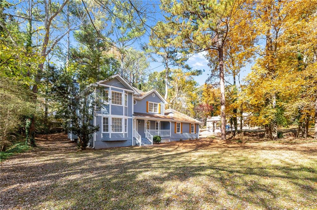 800 Post Rd Circle Stone Mountain, GA 30088 - Photo 2 of 45 a front view of a house with a yard
