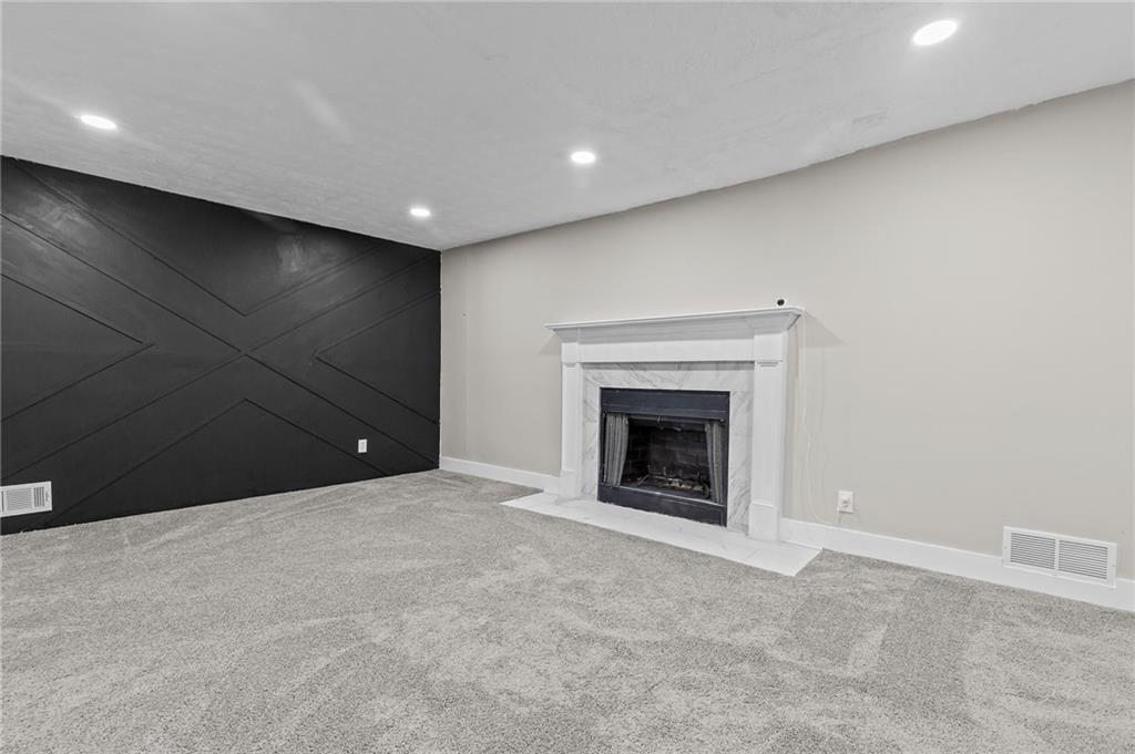 800 Post Rd Circle Stone Mountain, GA 30088 - Photo 21 of 45 a view of an empty room with a fireplace