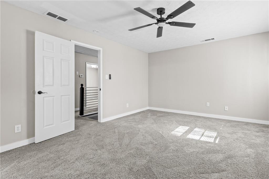 800 Post Rd Circle Stone Mountain, GA 30088 - Photo 30 of 45 an empty room with closet and windows