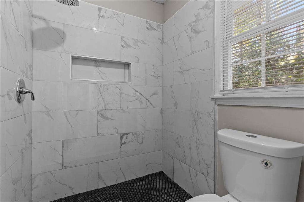 800 Post Rd Circle Stone Mountain, GA 30088 - Photo 32 of 45 a bathroom with a toilet and a shower