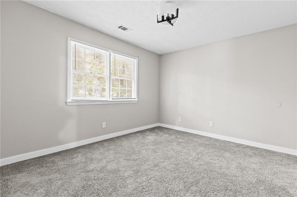 800 Post Rd Circle Stone Mountain, GA 30088 - Photo 34 of 45 an empty room with a window