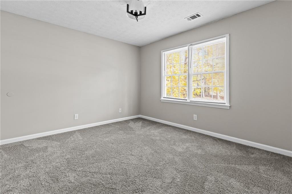 800 Post Rd Circle Stone Mountain, GA 30088 - Photo 37 of 45 an empty room with a window