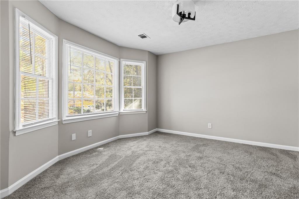 800 Post Rd Circle Stone Mountain, GA 30088 - Photo 39 of 45 a view of an empty room with a window