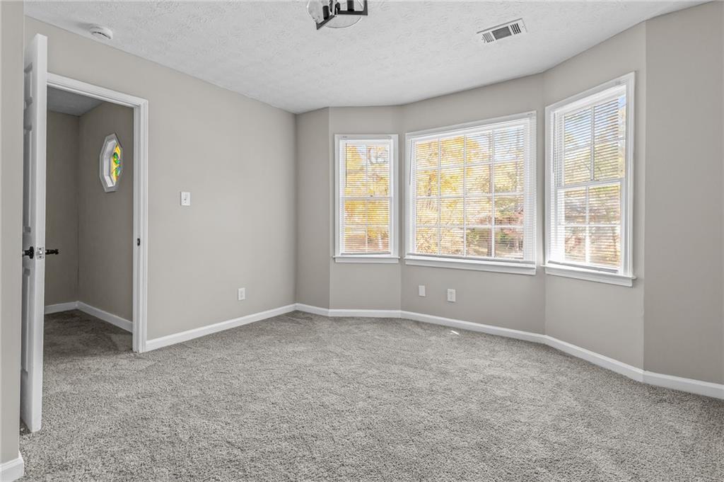 800 Post Rd Circle Stone Mountain, GA 30088 - Photo 40 of 45 an empty room with windows and closet