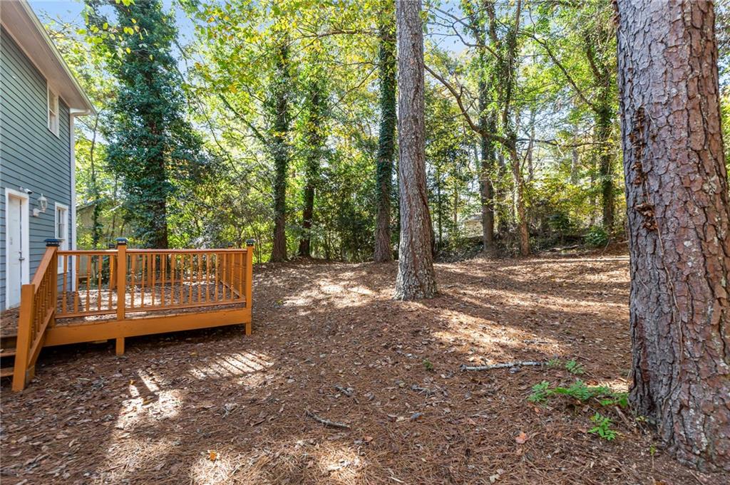 800 Post Rd Circle Stone Mountain, GA 30088 - Photo 42 of 45 a view of a wooden deck with a trees