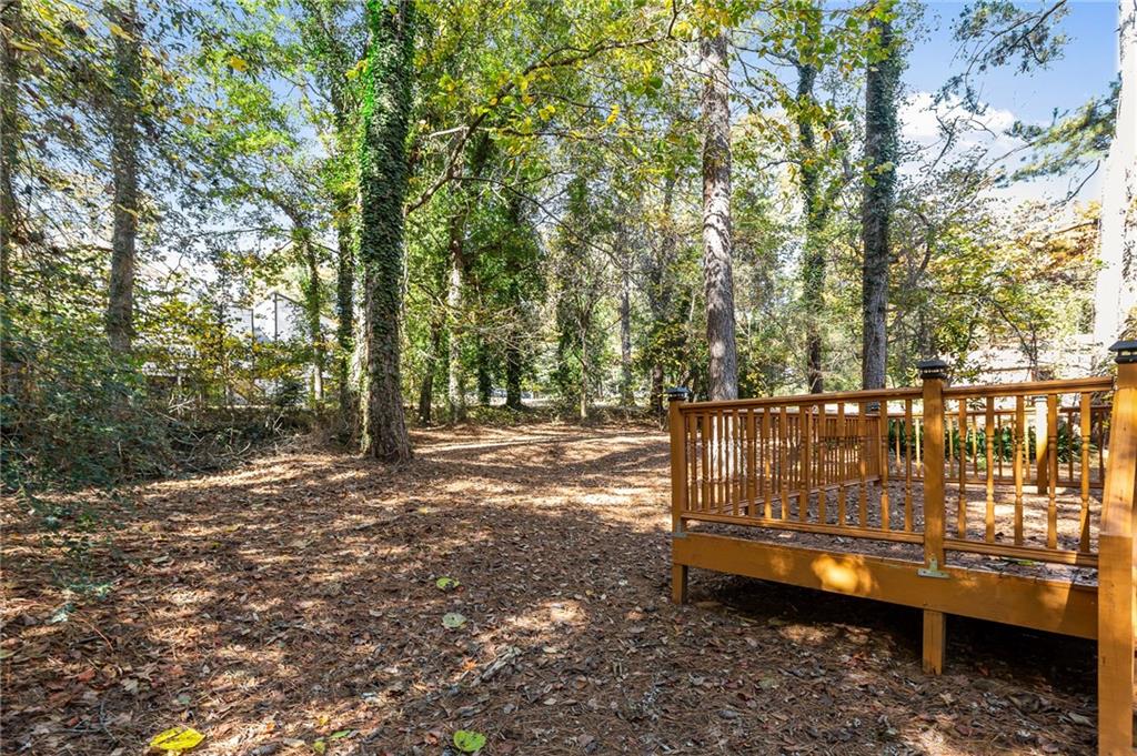 800 Post Rd Circle Stone Mountain, GA 30088 - Photo 43 of 45 a view of a bench in a forest