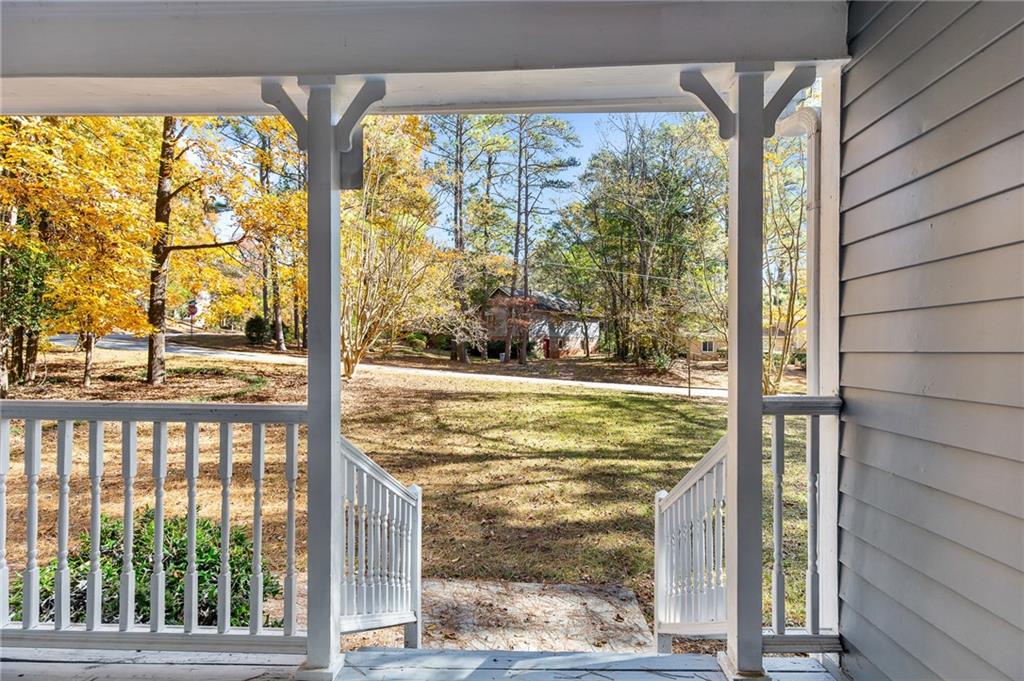 800 Post Rd Circle Stone Mountain, GA 30088 - Photo 5 of 45 a view of a glass door with a trees from a window