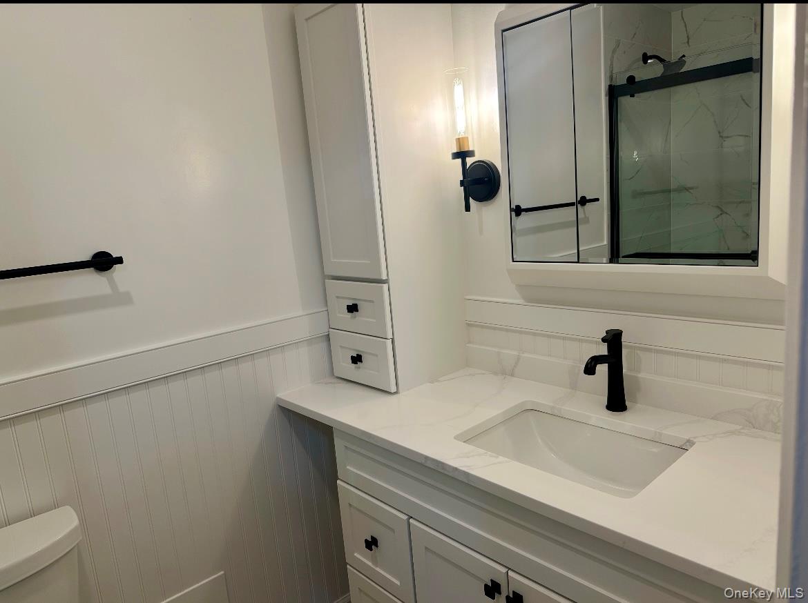 31 Maple Avenue, Unit 2A Hastings-on-Hudson, NY 10706 - Photo 15 of 23 a bathroom with a sink and mirror