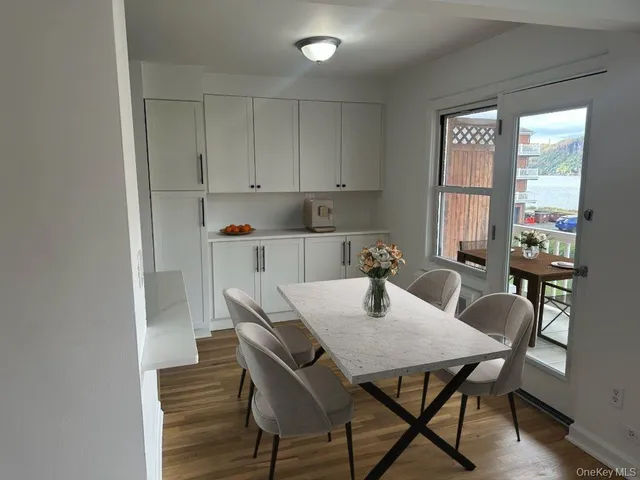 a view of a dining room with furniture and window