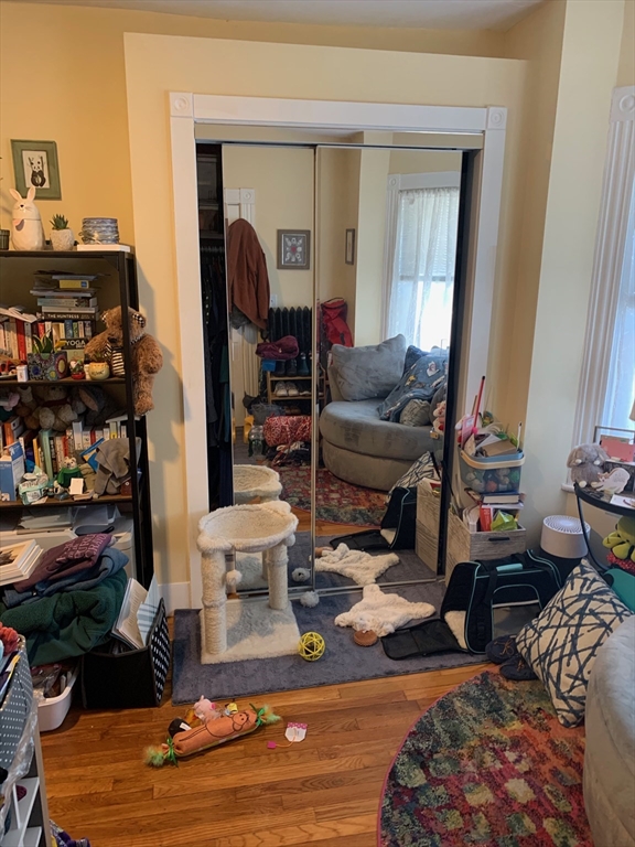 5 Blake Street, Unit 1 Cambridge, MA 02140 - Photo 12 of 41 a living room with furniture and a wooden floor