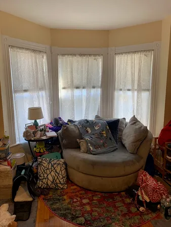 a bed room with furniture and wooden floor