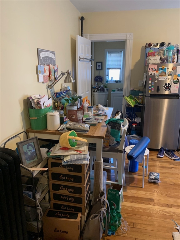 5 Blake Street, Unit 1 Cambridge, MA 02140 - Photo 16 of 41 a bed room with furniture and wooden floor