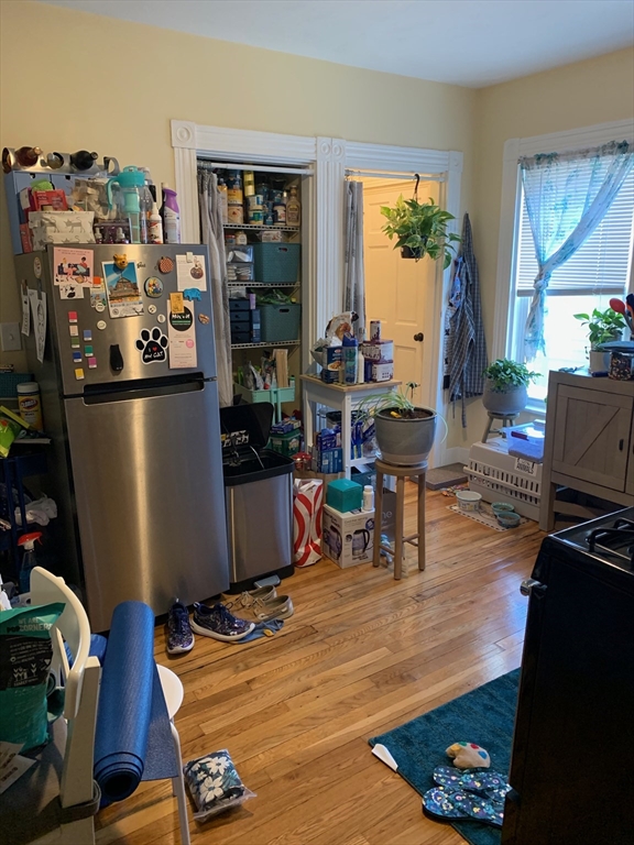 5 Blake Street, Unit 1 Cambridge, MA 02140 - Photo 17 of 41 a view of a workspace with furniture and a living room