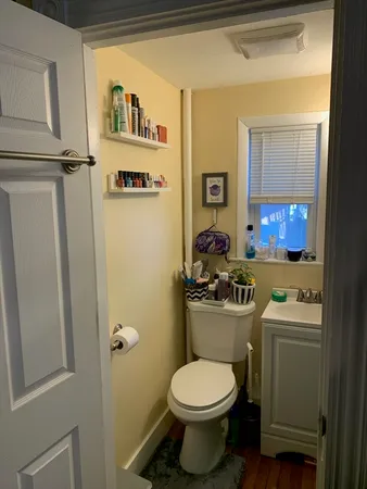 a bathroom with a shower and a mirror
