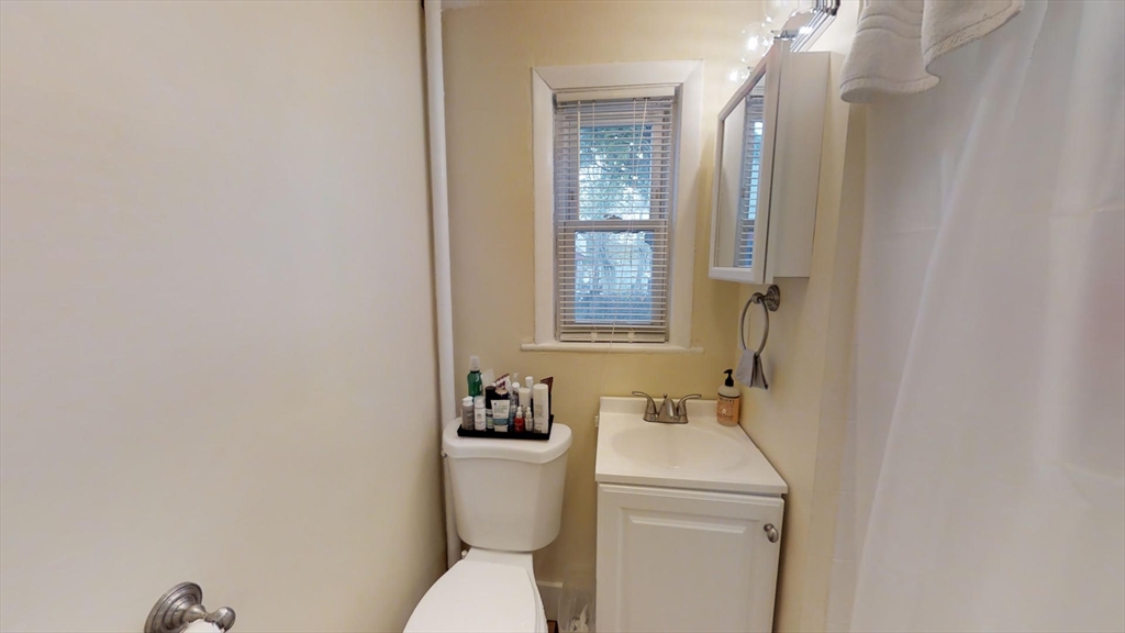 5 Blake Street, Unit 1 Cambridge, MA 02140 - Photo 3 of 41 a bathroom with a sink and a toilet