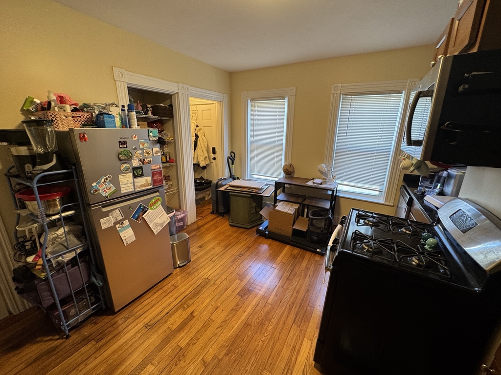 5 Blake Street, Unit 1 Cambridge, MA 02140 - Photo 35 of 41 a view of a living room with furniture and a flat screen tv