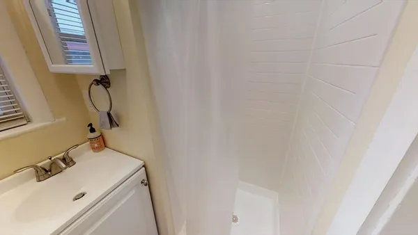 a bathroom with a sink and washing machine