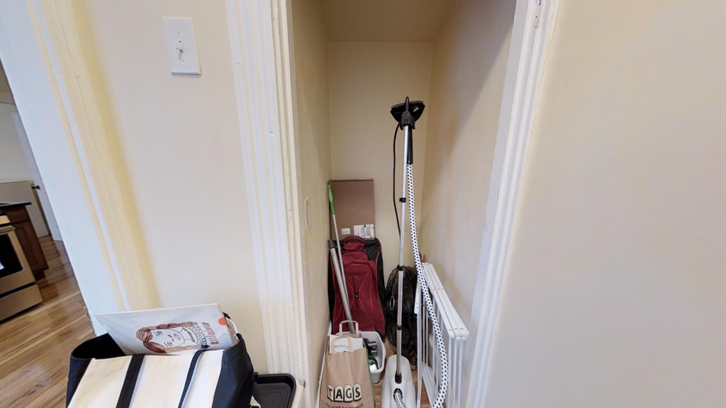 5 Blake Street, Unit 1 Cambridge, MA 02140 - Photo 6 of 41 a view of a hallway with furniture and closet