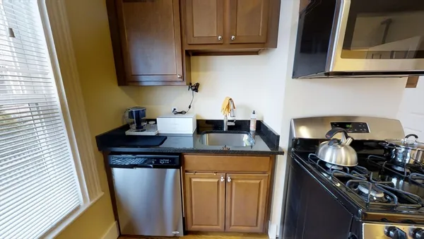 a kitchen with a sink and cabinets