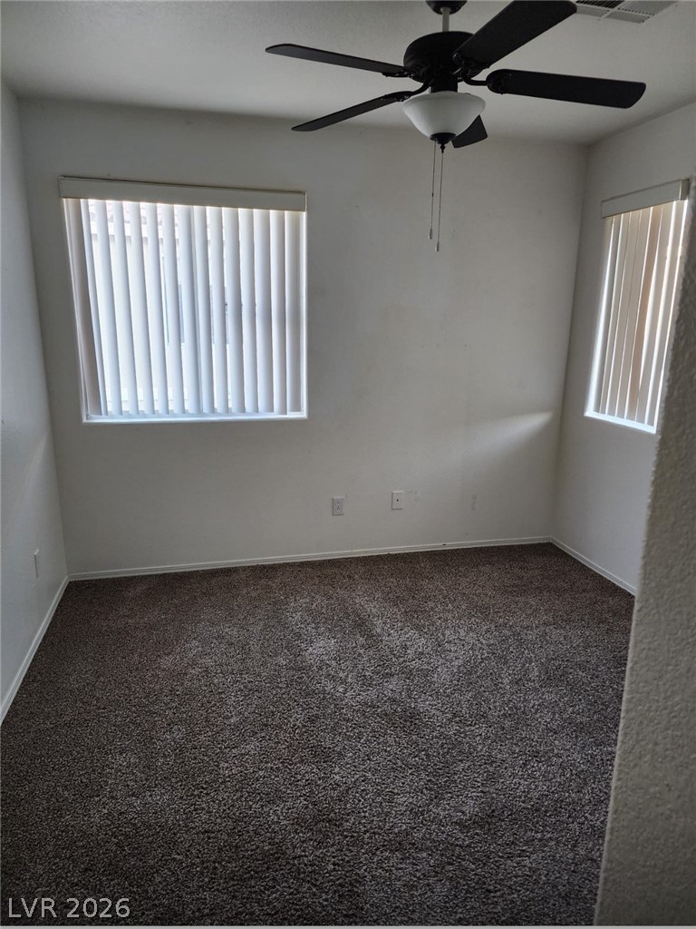 11901 Fairfax Ridge Street Las Vegas, NV 89183 - Photo 30 of 46 Unfurnished room featuring carpet, healthy amount of natural light, and a ceiling fan