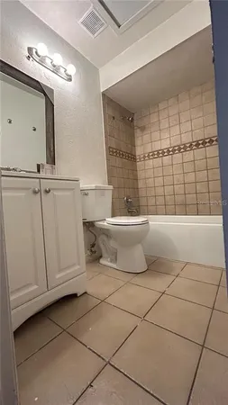 a bathroom with a toilet a sink and a shower