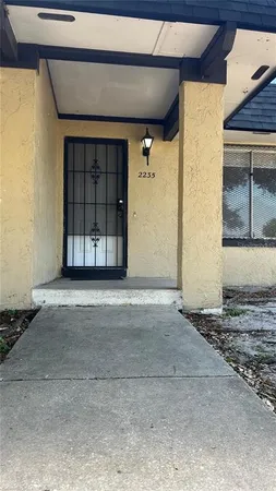 a view of a house with a parking space