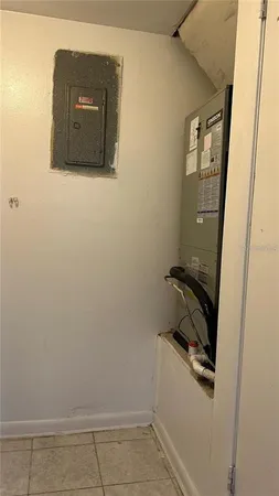 a room with a wooden floor and mirror