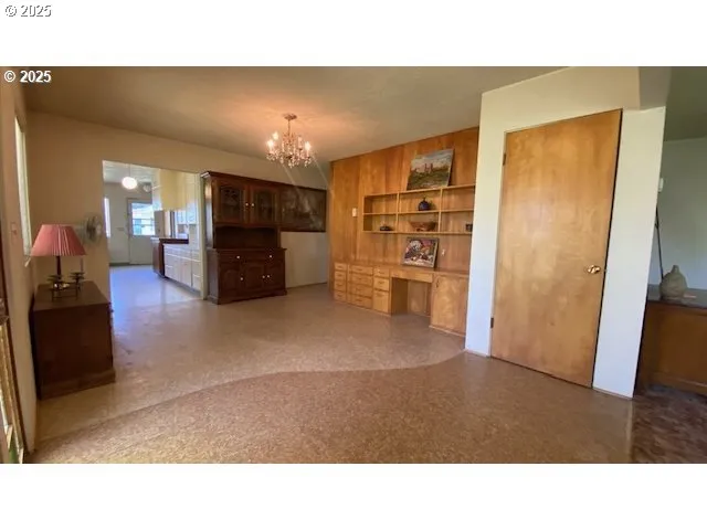 a room with furniture and a flat screen tv