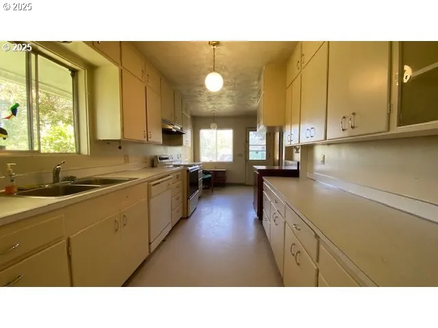a kitchen with a sink and cabinets
