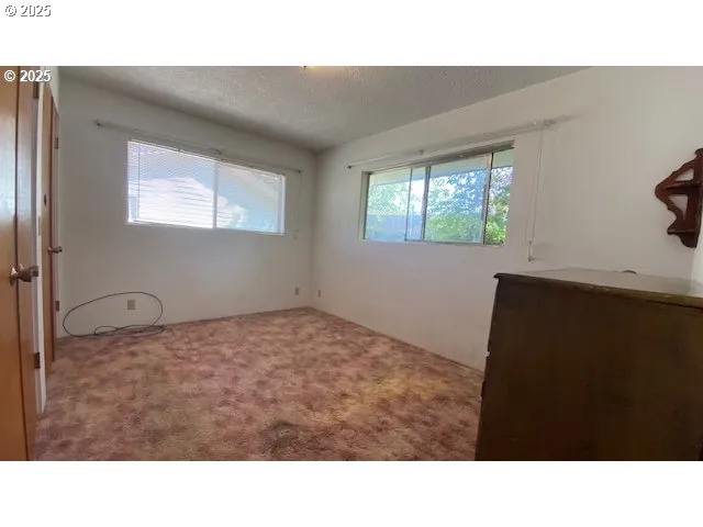 a room with a bed and a window