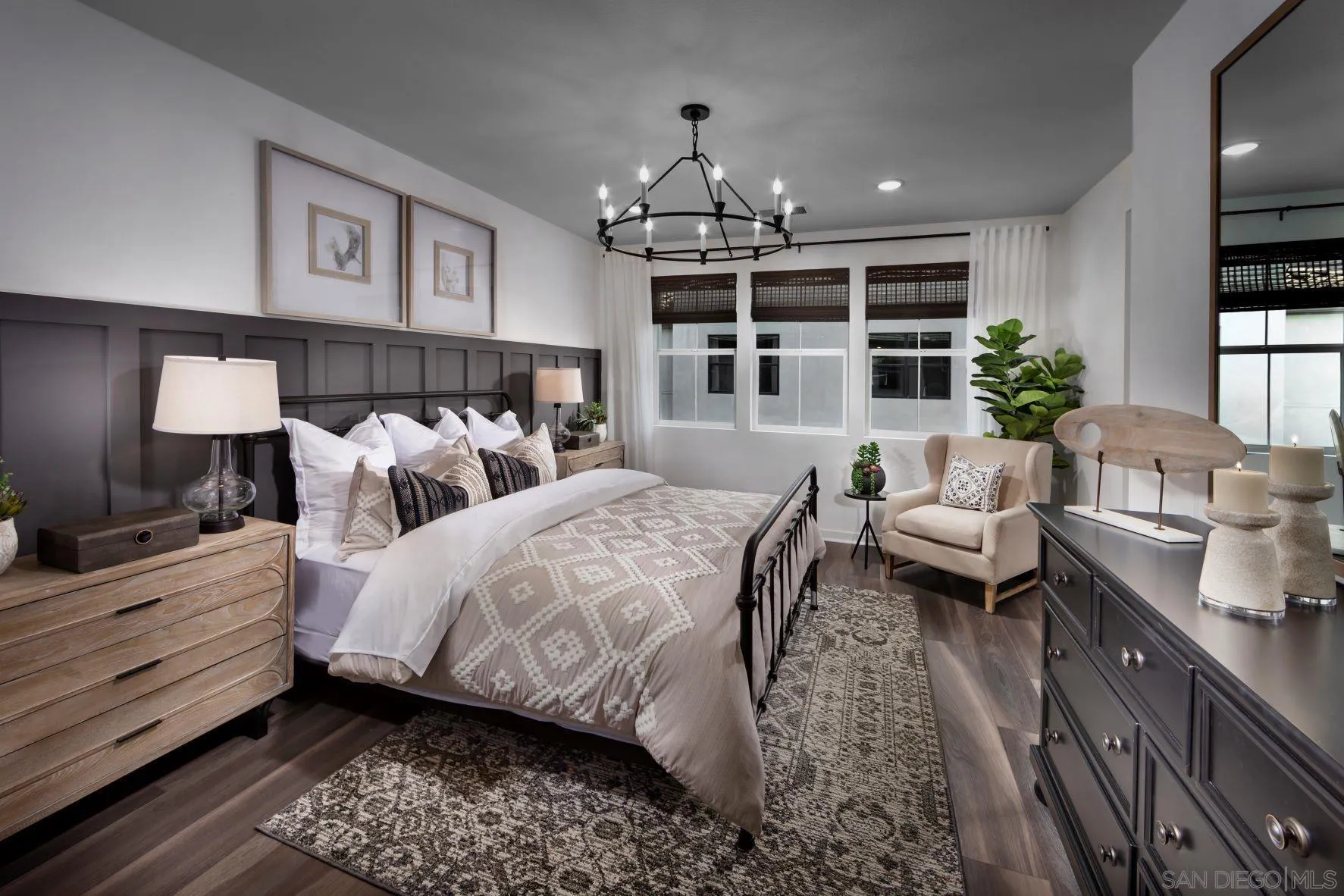 13084 Olympus Circle, Unit 3 Poway, CA 92064 - Photo 4 of 11 a spacious bedroom with two beds and a chandelier