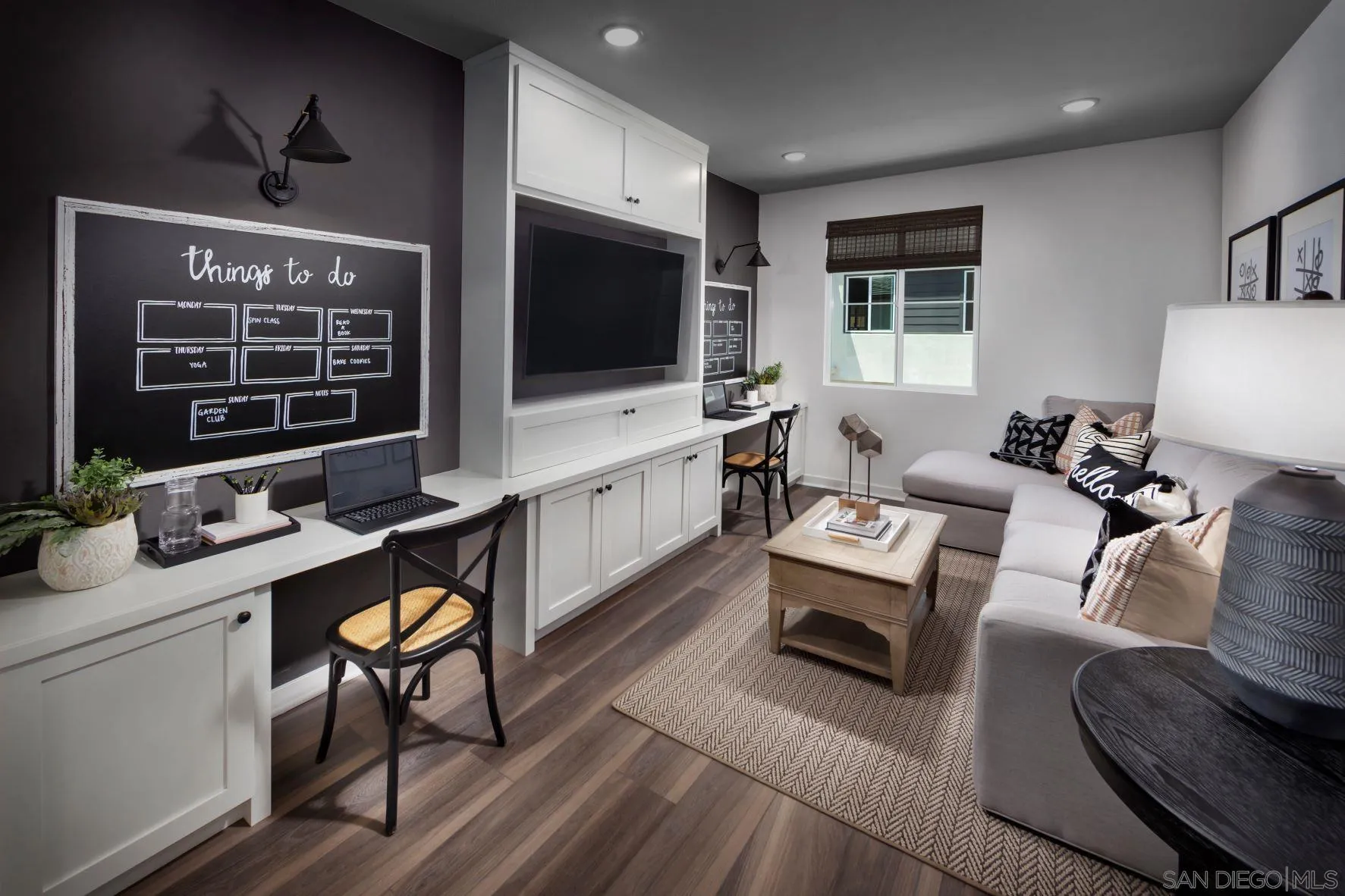 13084 Olympus Circle, Unit 3 Poway, CA 92064 - Photo 5 of 11 a living room with furniture a flat screen tv and kitchen view