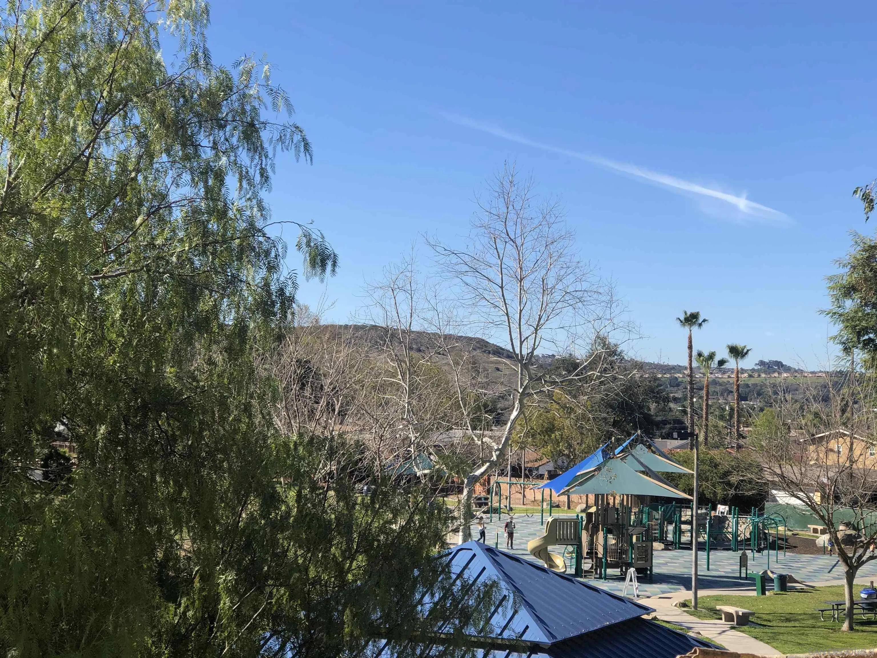 13084 Olympus Circle, Unit 3 Poway, CA 92064 - Photo 9 of 11 a view of a city with tall buildings