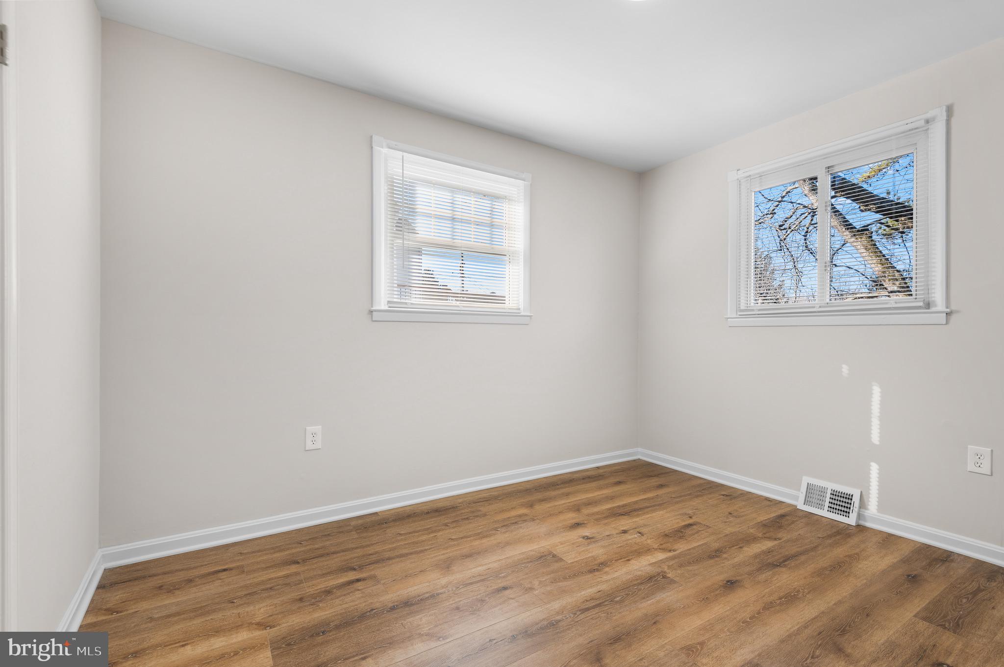 820 Templecliff Road Baltimore, MD 21208 - Photo 2 of 44 wooden floor in an empty room with a window