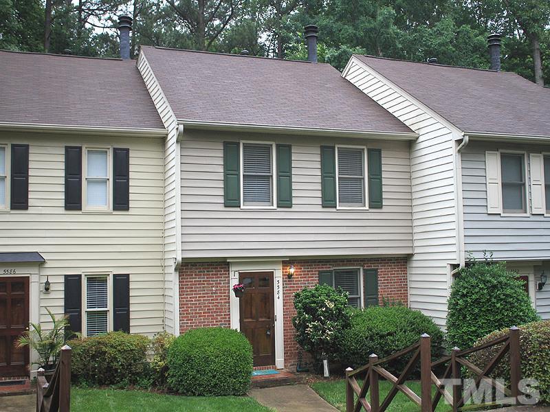 5584 Hamstead Crossing Raleigh, NC 27612 - Photo 2 of 17 a front view of a house with a yard and plants