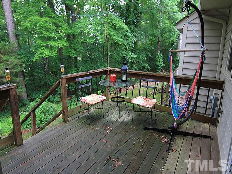 5584 Hamstead Crossing Raleigh, NC 27612 - Photo 15 of 17 a view of balcony with wooden floor and outdoor seating