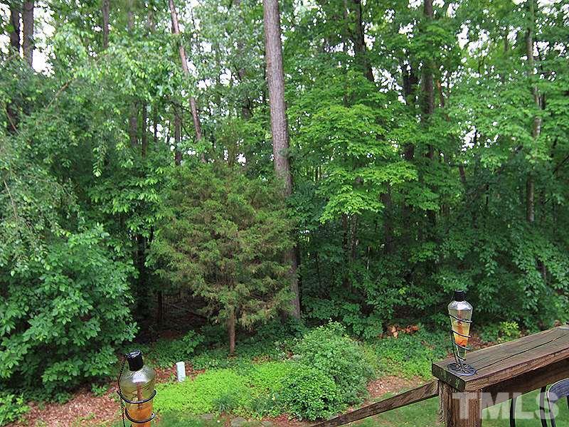 5584 Hamstead Crossing Raleigh, NC 27612 - Photo 16 of 17 a backyard of a house with lots of green space and garden