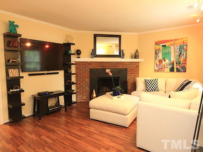 5584 Hamstead Crossing Raleigh, NC 27612 - Photo 3 of 17 a living room with furniture and a flat screen tv