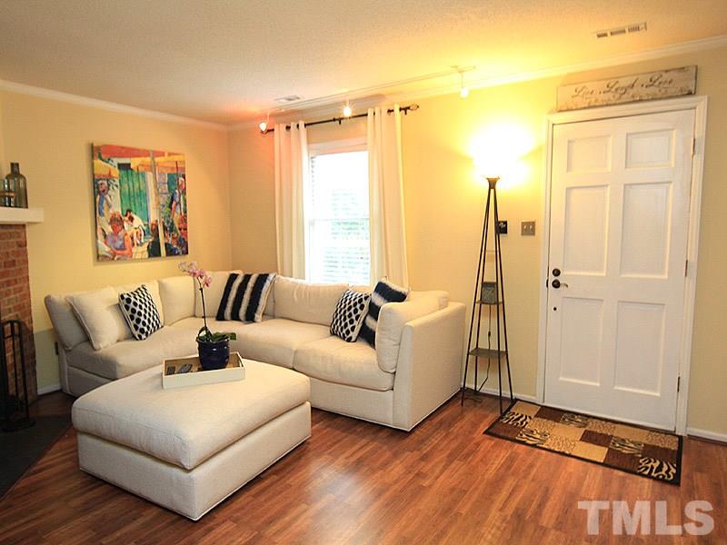 5584 Hamstead Crossing Raleigh, NC 27612 - Photo 4 of 17 a living room with furniture and a window