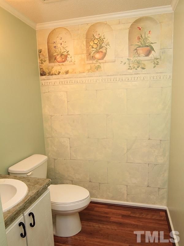 5584 Hamstead Crossing Raleigh, NC 27612 - Photo 8 of 17 a bathroom with a toilet and a shower curtain