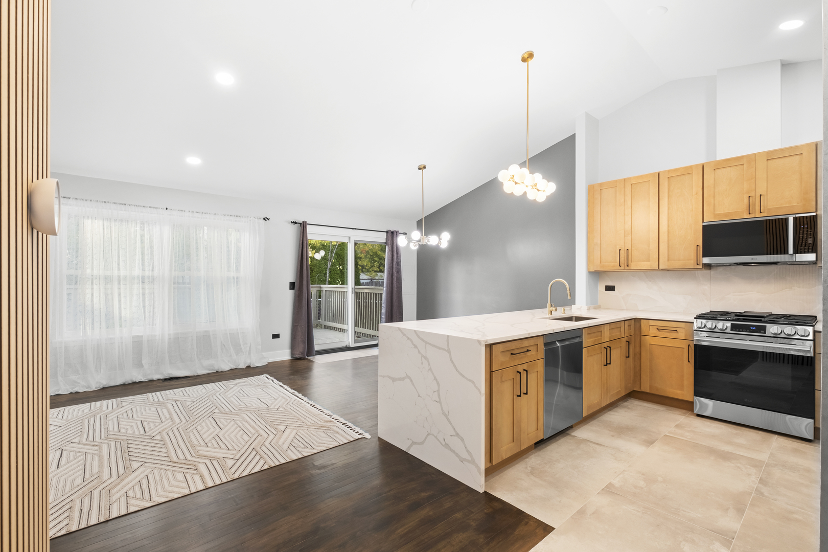 531 Lasalle Lane Buffalo Grove, IL 60089 - Photo 4 of 15 a large kitchen with stainless steel appliances granite countertop a stove a sink and a refrigerator