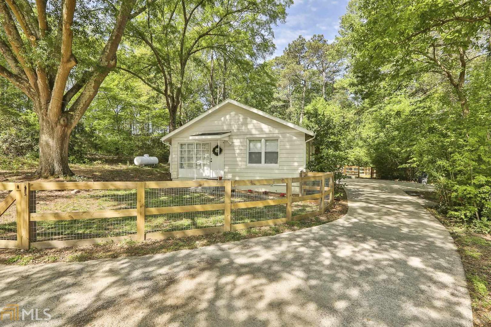 9286 Cedar Grove Road Fairburn, GA 30213 - Photo 1 of 1 a view of a house with a yard