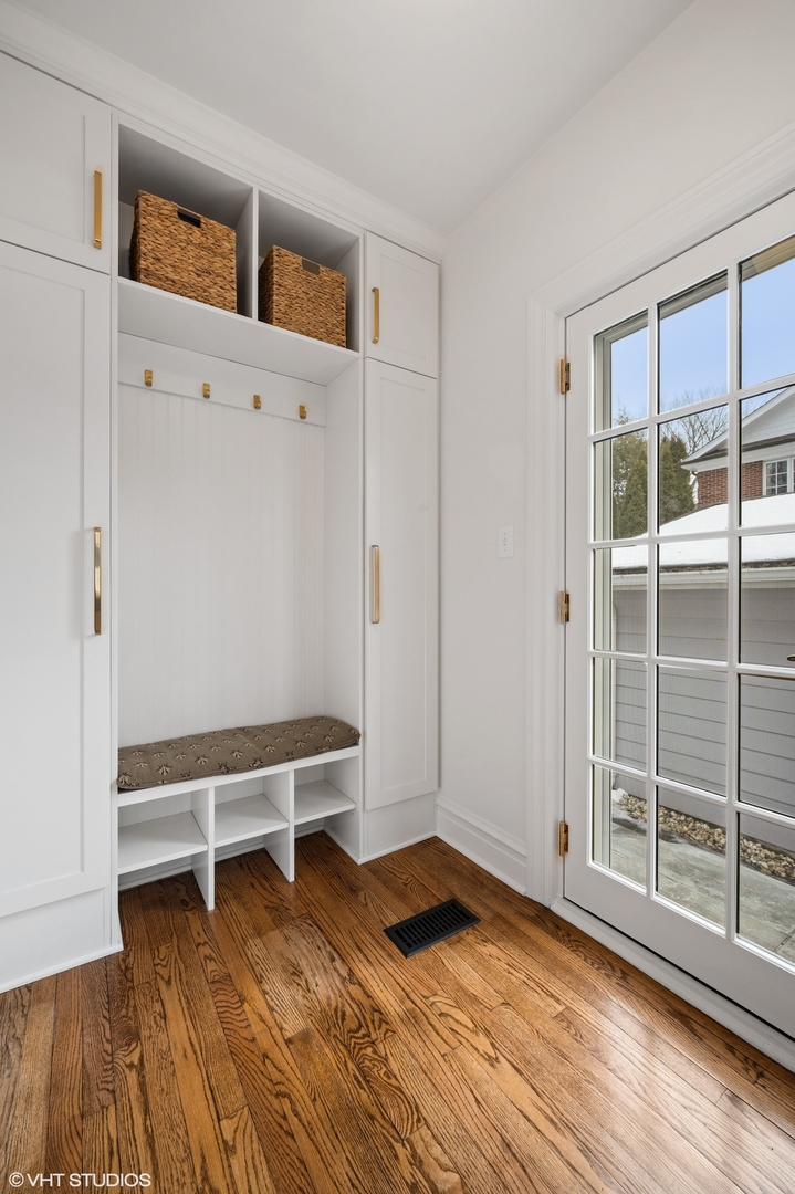 402 Willow Road Winnetka, IL 60093 - Photo 12 of 31 a view of an empty room with wooden floor and windows