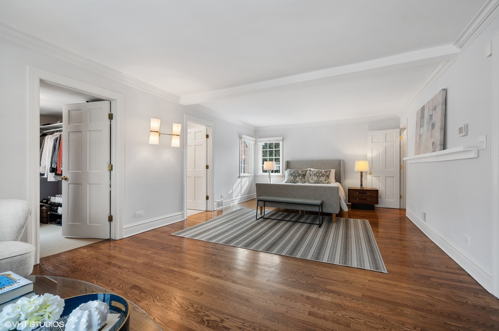 402 Willow Road Winnetka, IL 60093 - Photo 13 of 31 a bedroom with a bed and wooden floor